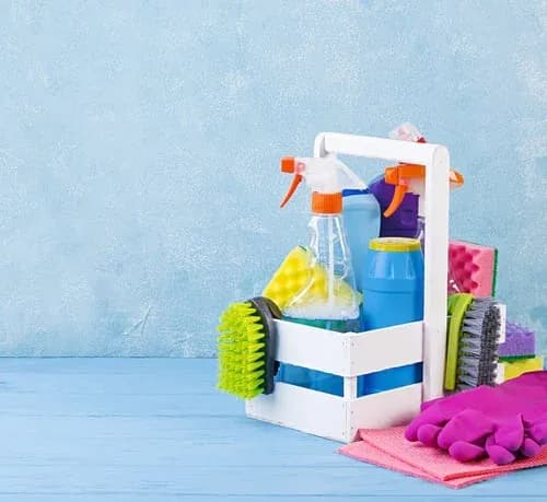 Cleaning caddy with sprays, sponges and cloths prepared for a recurring house cleaning visit