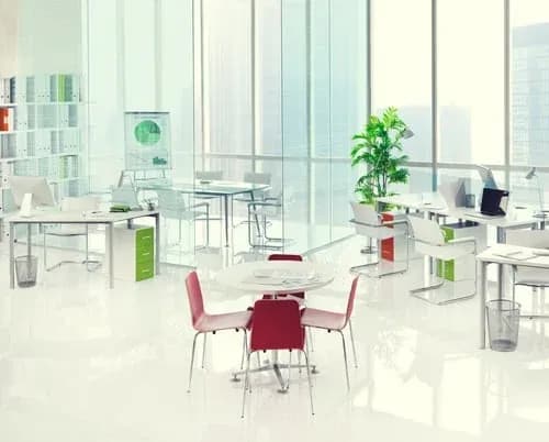 Bright, spotless open-plan office with clean glass, desks and polished floors
