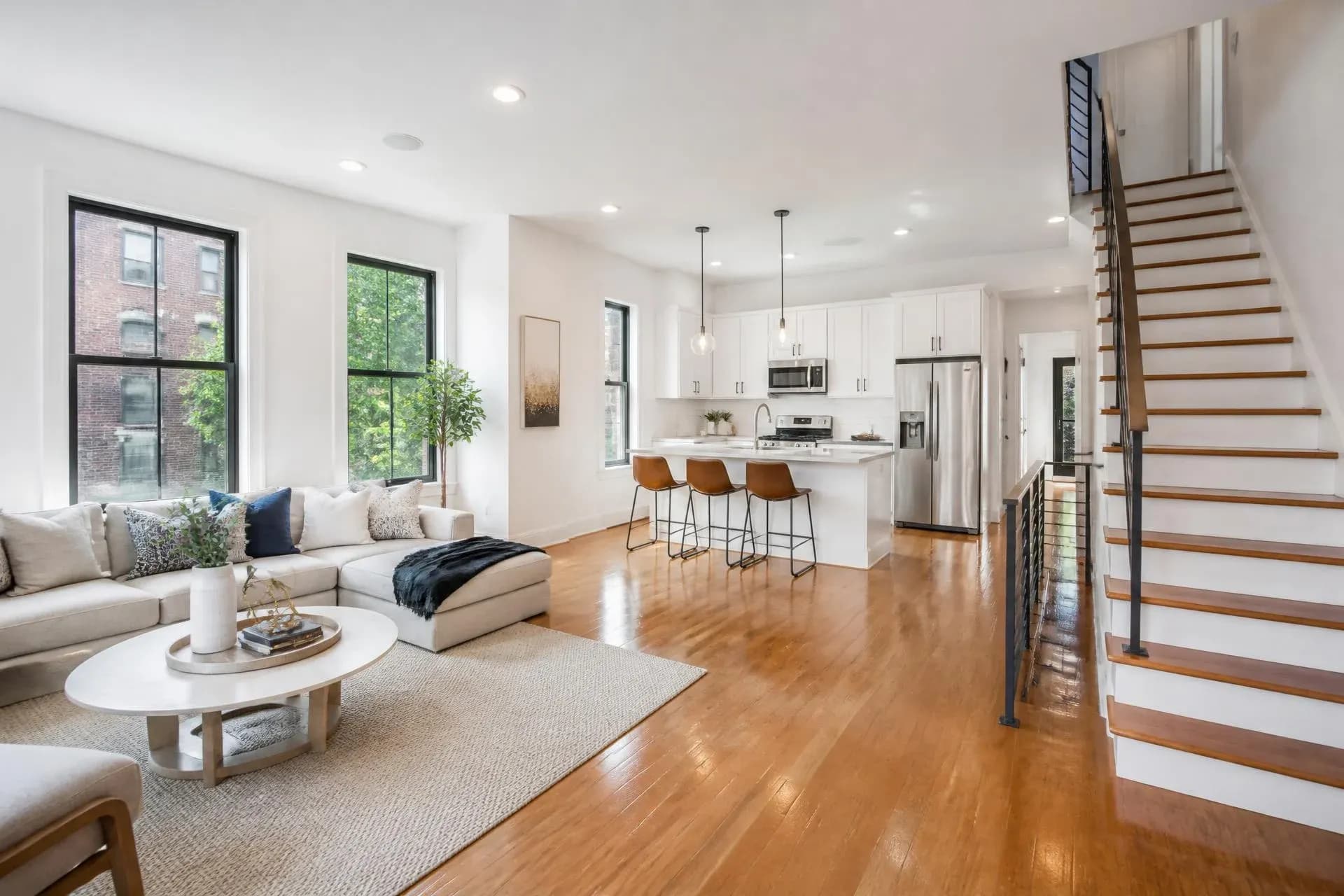 Bright, spotless open-plan living room and kitchen after a professional cleaning in Philadelphia