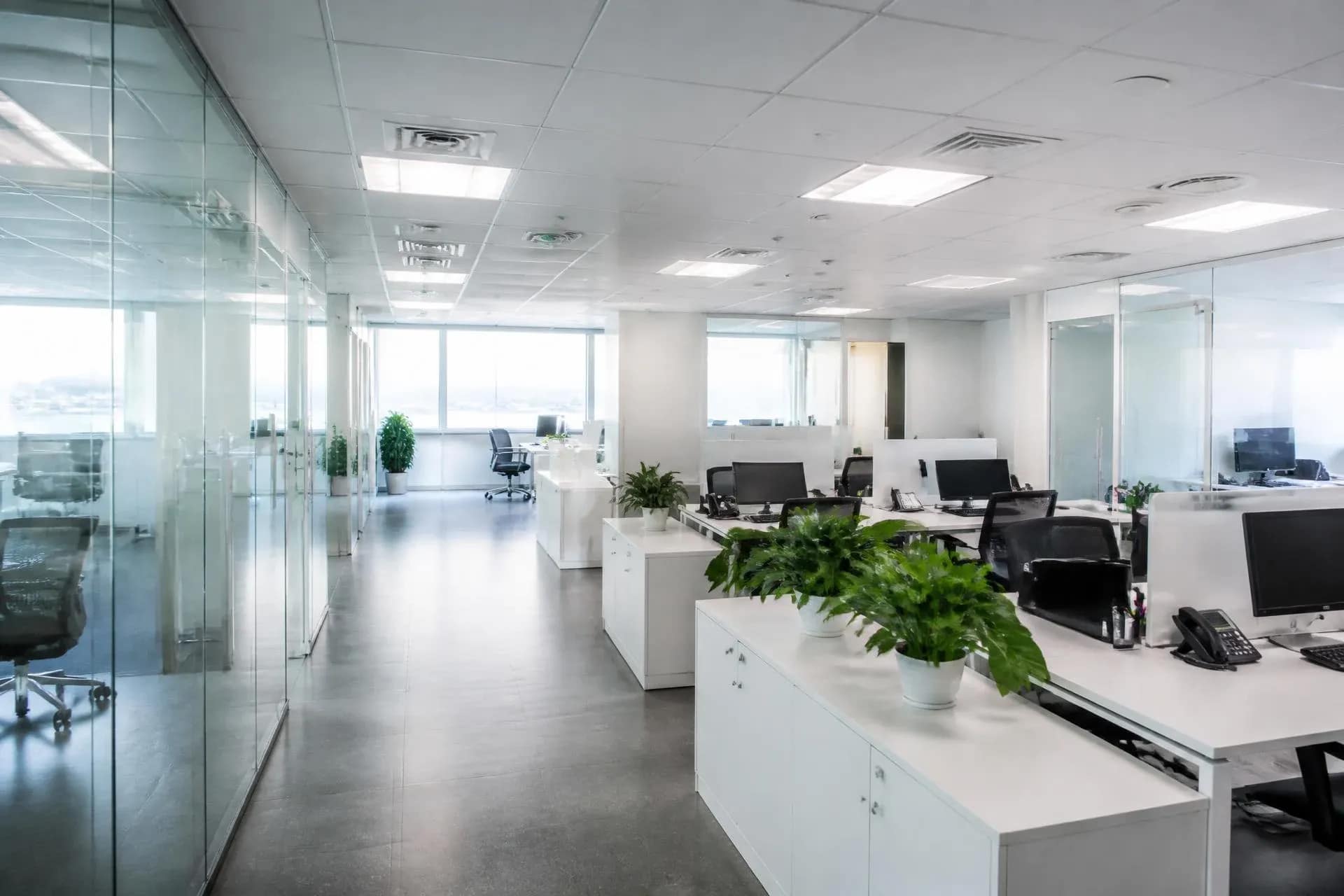 Spotless modern open-plan office with clean desks and floors after a commercial cleaning service