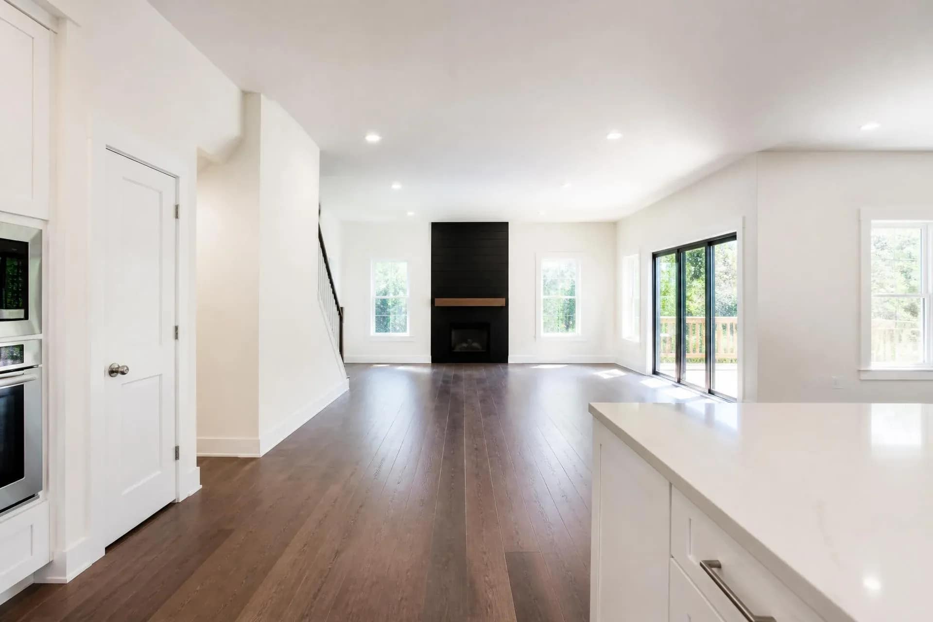 Newly built white interior with drywall dust and debris awaiting post-construction cleaning